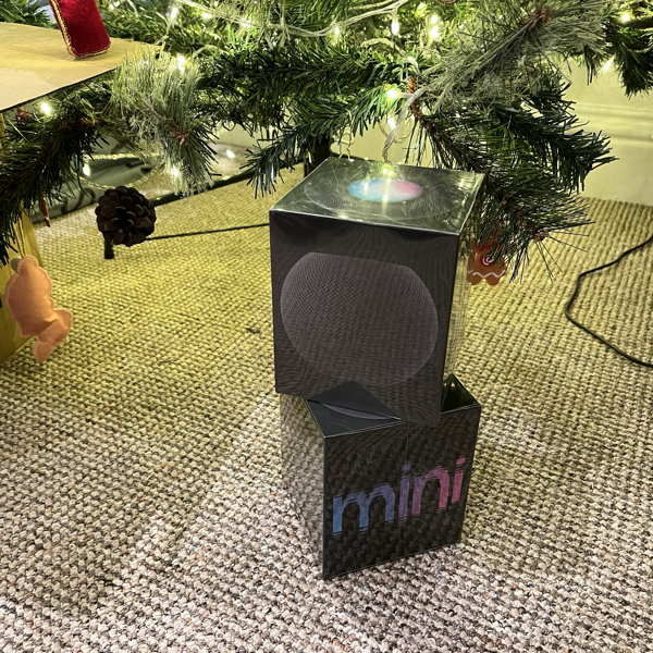 2 Apple HomePod boxes, sealed, under Christmas tree